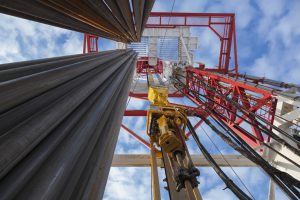 Oil rig with pipes from bottom to top view