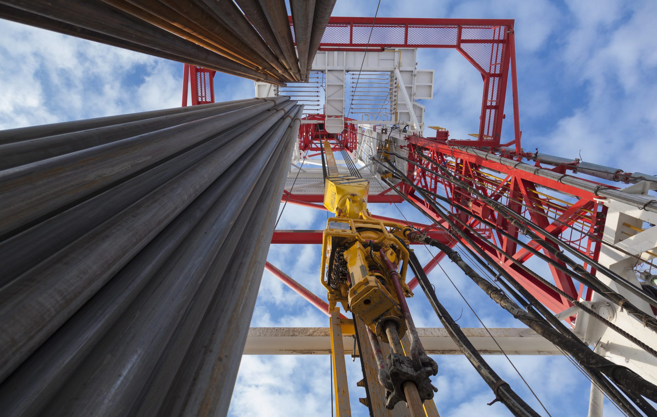 Oil rig with pipes from bottom to top view